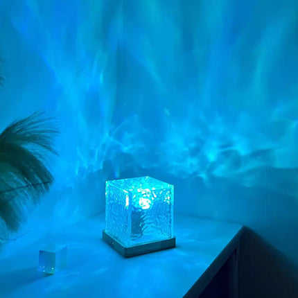 LED Night Light with soothing water ripple projection in blue ambiance on a table.